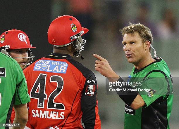 Shane Warne of the Melbourne Stars has a heated exchange with Marlon Samuels of the Melbourne Renegades during the Big Bash League match between the...