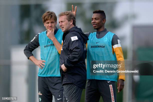 Eljero Elia of Bremen jokes with assistant coach Matthias Hoenerbach during a training session at day two of the Werder Bremen Training Camp on...