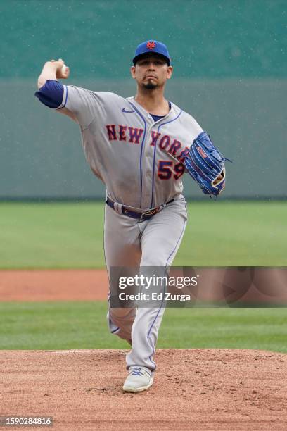 Pitcher Carlos Carrasco of the New York Mets warms up prior to action against the Kansas City Royals in the first inning at Kauffman Stadium on...