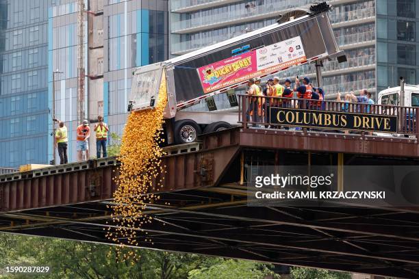 Rubber ducks are dumped from the Columbus Bridge into the Chicago River at the start of the Chicago Duck Derby in Chicago, Illinois, on August 10,...
