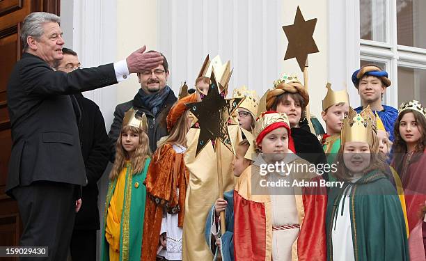 Child Epiphany carolers, known as Sternsinger in German, visit German President Joachim Gauck at Bellevue presidential palace on January 6, 2013 in...