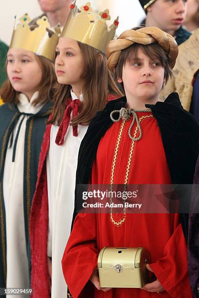 Child Epiphany carolers, known as Sternsinger in German, visit German President Joachim Gauck at Bellevue presidential palace on January 6, 2013 in...