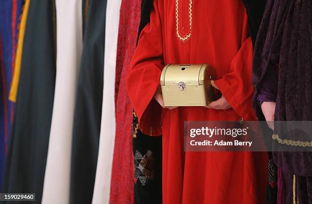 Child Epiphany carolers, known as Sternsinger in German, visit German President Joachim Gauck at Bellevue presidential palace on January 6, 2013 in...