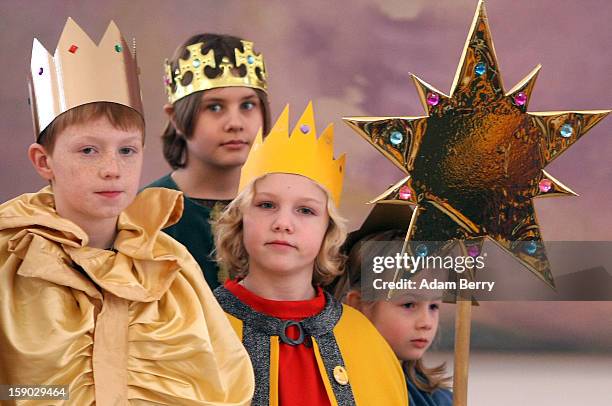 Child Epiphany carolers, known as Sternsinger in German, visit German President Joachim Gauck at Bellevue presidential palace on January 6, 2013 in...