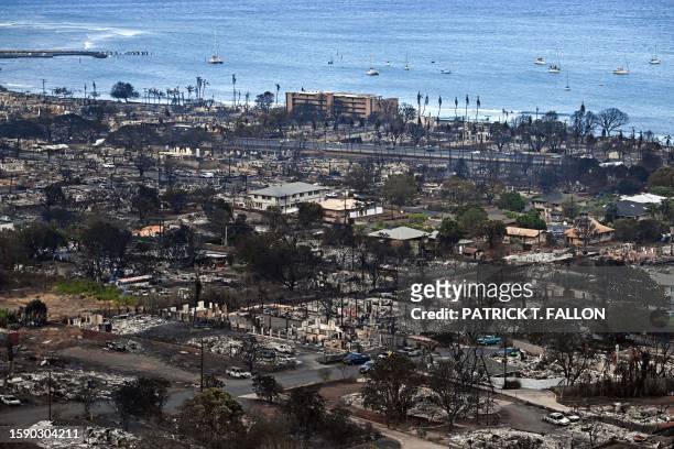 An aerial image taken on August 10, 2023 shows destroyed homes and buildings burned to the ground in Lahaina in the aftermath of wildfires in western...