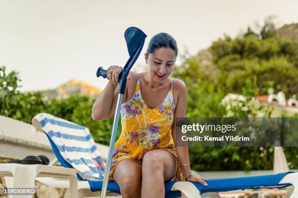 disabled woman having fun at pool - orthopedic surgery stock pictures, royalty-free photos & images