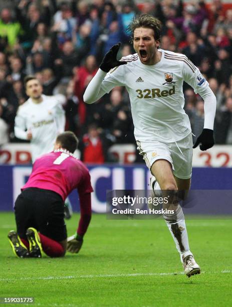 Miguel Michu of Swansea City celebrates as he scores their first goal during the FA Cup with Budweiser Third Round match between Swansea City and...