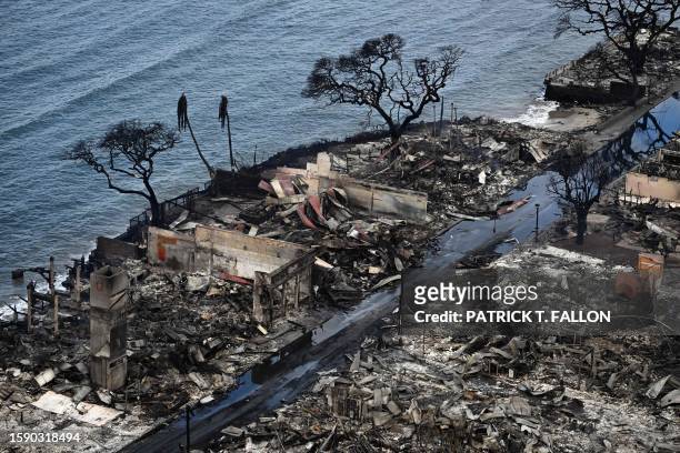 An aerial image taken on August 10, 2023 shows destroyed homes and buildings burned to the ground in Lahaina in the aftermath of wildfires in western...