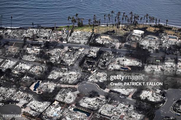 An aerial image taken on August 10, 2023 shows destroyed homes and buildings burned to the ground in Lahaina in the aftermath of wildfires in western...