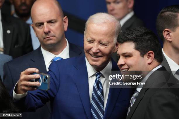 President Joe Biden takes a selfie after he spoke at the George E. Wahlen Department of Veterans Affairs Medical Center on August 10, 2023 in Salt...