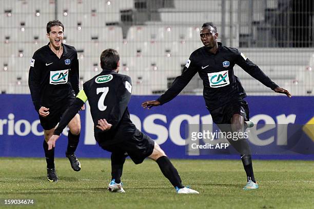 S Alassane N'Diaye is congratulated by teammates after scoring a goal during the French Football Cup match CA Bastia vs Sporting Club de Bastia in...