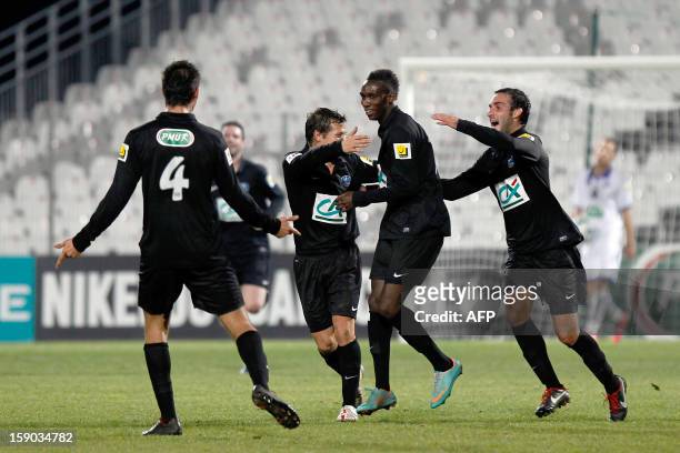 Bastia's Alassane N'Diaye is congratulated by teammates after scoring a goal during the French Football Cup match CA Bastia vs Sporting Club de...
