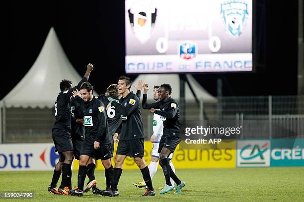Bastia's Alassane N'Diaye is congratulated by teammates after scoring a goal during the French Football Cup match CA Bastia vs Sporting Club de...