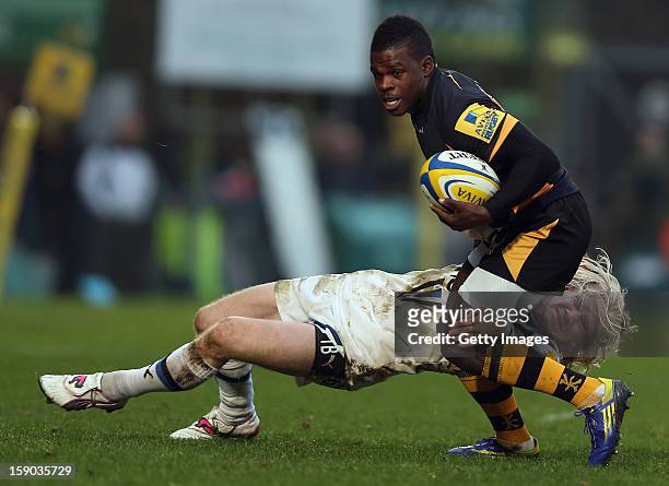 Christian Wade of London Wasps is tackled by Tom Biggs of Bath Rugby on his way to scoring a try during the Aviva Premiership match between London...