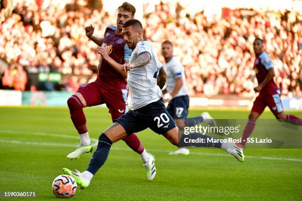 Mattia Zaccagni of SS Lazio compete for the ball with Calum Chambers of Aston Villa during the pre-season friendly match between Aston Villa and SS...