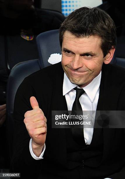 Barcelona's coach Tito Vilanova gives the thumb up prior to the Spanish league football match FC Barcelona vs RCD Espanyol at the Camp Nou stadium in...