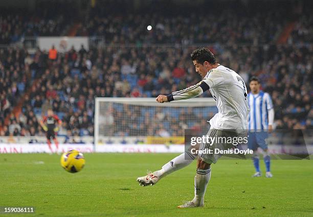 Cristiano Ronaldo of Real Madrid CF scores his team's 4th goal from a free kick during the La Liga match between Real Madrid CF and Real Sociedad de...