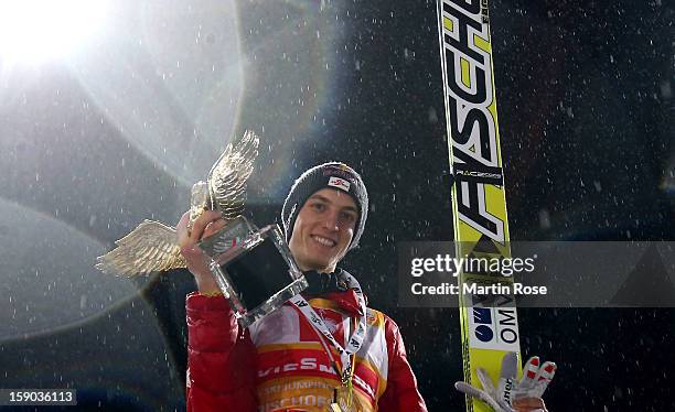 Gregor Schlierenzauer of Austria celebrates after winning the FIS Ski Jumping World Cup event at the 61st Four Hills ski jumping tournament at...