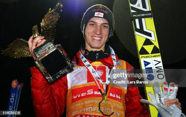 Gregor Schlierenzauer of Austria celebrates after winning the FIS Ski Jumping World Cup event of the 61st Four Hills ski jumping tournament at...