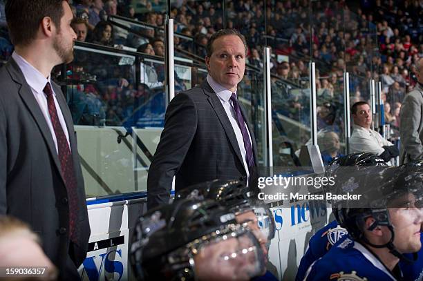 Dave Lowry, head coach of the Victoria Royals stands on the bench at the Kelowna Rockets on January 2, 2013 at Prospera Place in Kelowna, British...