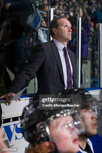 Dave Lowry, head coach of the Victoria Royals watches the replay from the bench at the Kelowna Rockets on January 2, 2013 at Prospera Place in...