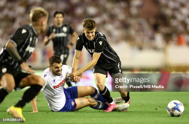Ioannis Konstantelias of PAOK is challenged by Marko Livaja of Hajduk Split during the UEFA Conference League Third Qualifying Round, 1st leg match...
