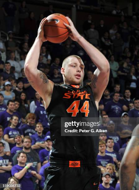 Center Philip Jurick of the Oklahoma State Cowboys grabs a defensive rebound against the Kansas State Wildcats during the second half on January 5,...