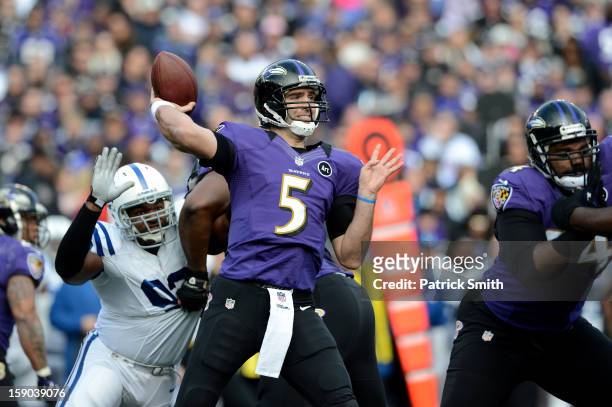 Joe Flacco of the Baltimore Ravens throws a pass in the first half against the Indianapolis Colts during the AFC Wild Card Playoff Game at M&T Bank...