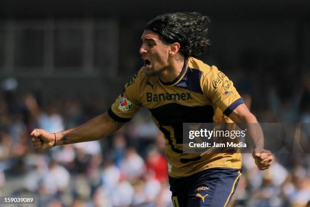 Martin Bravo of Pumas celebrates a goal against Atlas during a match between Pumas v Atlas as part of the Clausura 2013 Liga MX at Olimpico Stadium...