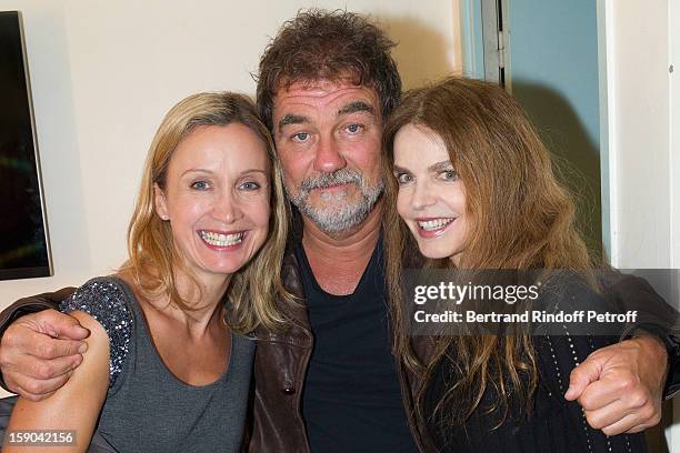 Olivier Marchal poses with his wife Catherine and Cyrielle Clair after attending the show of French impersonator Laurent Gerra at Olympia hall on...