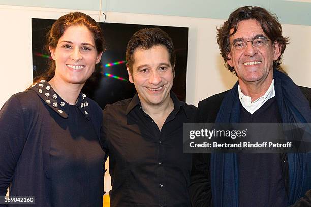 French impersonator Laurent Gerra poses with Luc Ferry and Ferry's wife Marie-Caroline in Gerra's dressing room following his one man show of at...