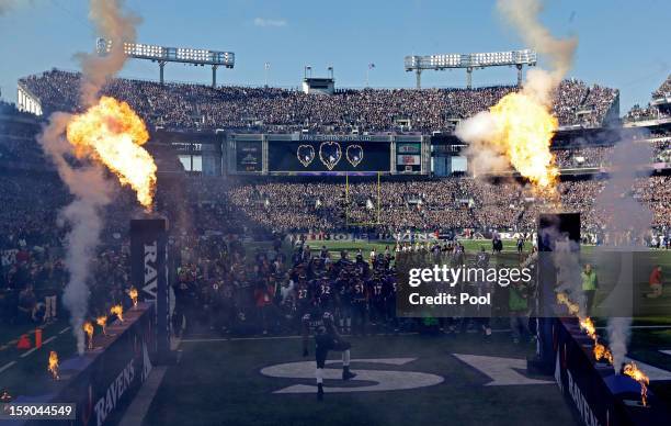 Ray Lewis of the Baltimore Ravens dances in front of his teammates on the field during player introductions against the Indianapolis Colts during the...