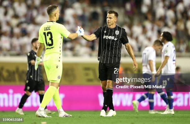 Hajduk Split Goalkeeper Ivan Lucic and Stefan Schwab of PAOK shake hands after UEFA Conference League Third Qualifying Round, 1st leg match between...