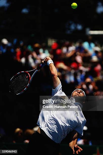 Benjamin Becker of Germany serves in his first round match against Lukas Rosol of Czechoslovakia during day one of the Heineken Open at ASB Tennis...