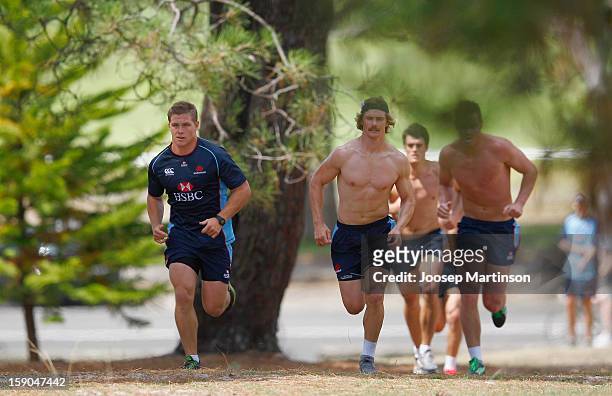 Michael Hooper and Berrick Barnes run uphill during a Waratahs Super Rugby training session at Centenial Park on January 7, 2013 in Sydney, Australia.