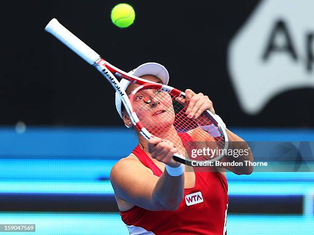 Nadia Petrova of Russia plays an unorthodox shot in her first round match against Roberta Vinci of Italy during day two of the Sydney International...