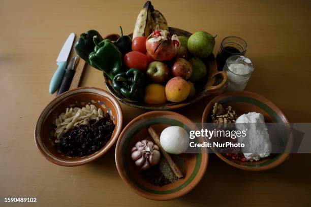 View of ingredients for the preparation of Chiles en Nogada in Mexico City, whose base is poblano chili stuffed with ground pork, tomato, some fruits...