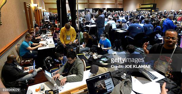 Journalists and visitors arrive to pre opening event ''CES Unveiled'' event during the International Consumer Electronics Show in Mandalay Bay Hotel...