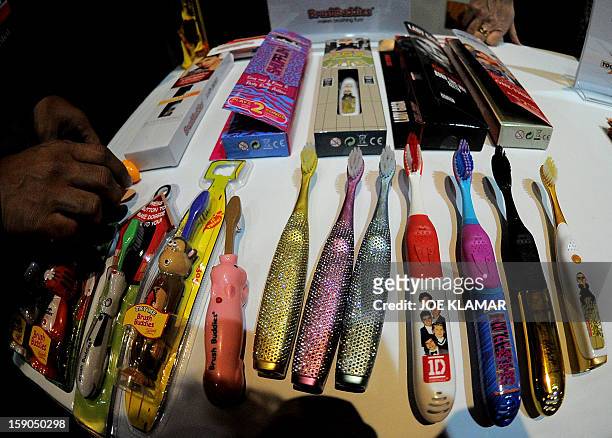 Brushbuddies dislays talking singing and popping-up tooth brushes during the opening event ''CES Unveiled'' during the International Consumer...