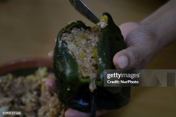 View of a poblano chile stuffed with ground beef stew to make Chiles en Nogada in Mexico City, on the eve of the national holidays in September to...