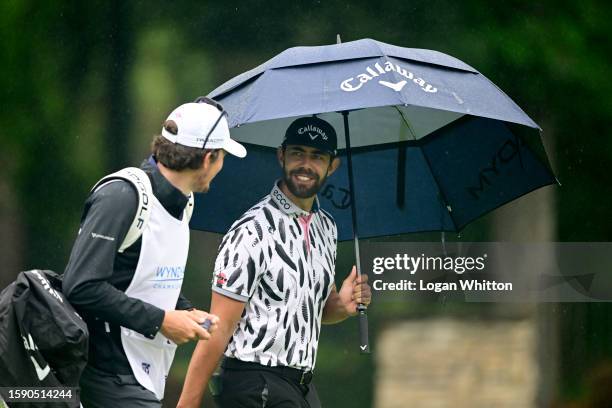 Erik van Rooyen of South Africa walks down the 13th fairway during the first round of the Wyndham Championship at Sedgefield Country Club on August...