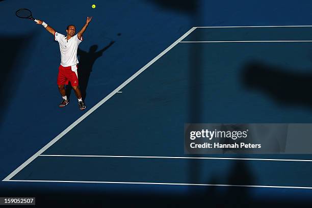 Olivier Rochus of Belgium serves during his first round match against Albert Ramos of Spain during day one of the Heineken Open at ASB Tennis Centre...