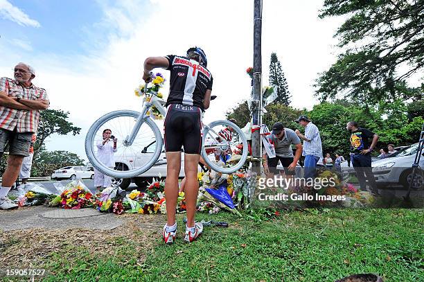 Mourners lay flowers at the sight of the accident where Burry Stander lost his life on January 6, 2012 in Balito South Africa. Burry was hit by a...