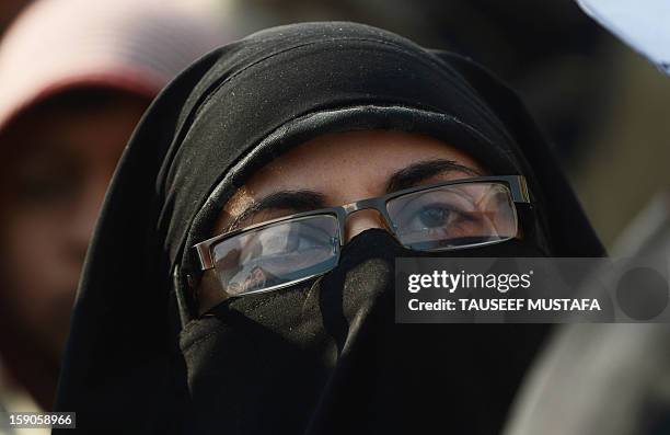 Kashmiri Muslim women shout anti Indian slogans during a protest against a court verdict sentencing two Kashmiris to life imprisonment in Srinagar on...