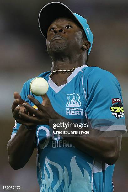 Kemar Roach of the Heat drops a catch during the Big Bash League match between the Brisbane Heat and the Sydney Sixers at The Gabba on January 7,...