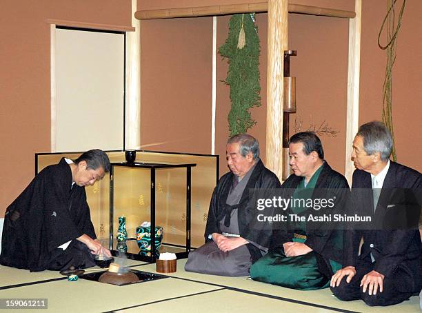 Urasenke grand tea master Sen Soshitsu XVI makes bowl of tea for the guests during Hatugama-Shiki, the first tea ceremony of new year at Urasenke...