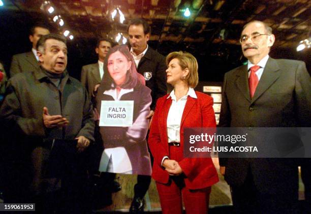 Presidential candidates Luis Eduardo Garzon , Noemi Sanin , Horacio Serpa and a poster of Ingrid Betancourt pose for a picture at the first electoral...