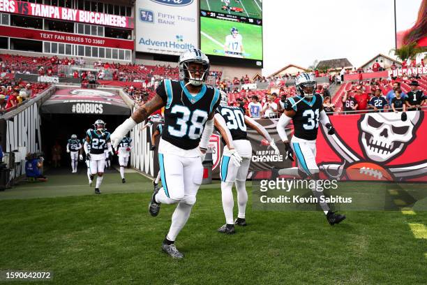 Myles Hartsfield and Juston Burris of the Carolina Panthers run onto the field prior to an NFL game against the Tampa Bay Buccaneers at Raymond James...