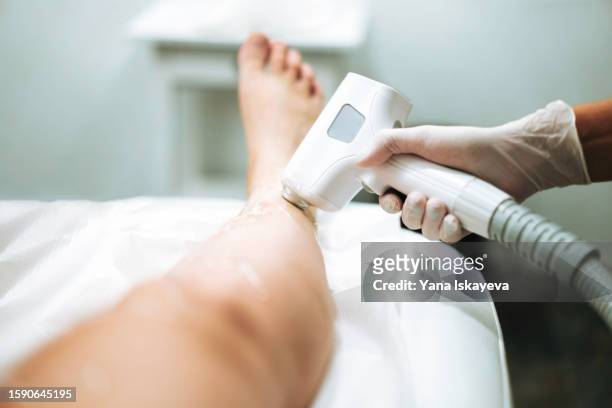 aesthetic medicine and professional skincare procedures. laser epilation with modern equipment - electrolysis stock pictures, royalty-free photos & images