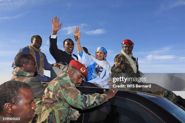 President Idriss Deby with his wife Hinda Deby wave from a car on December 18, 2012 in Biltine, Chad.